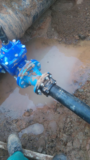 110mm HDPE main water supply installation across street for fuel station