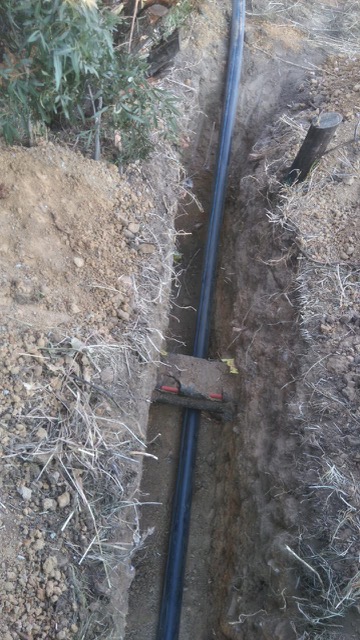 110mm HDPE main water supply installation across street for fuel station